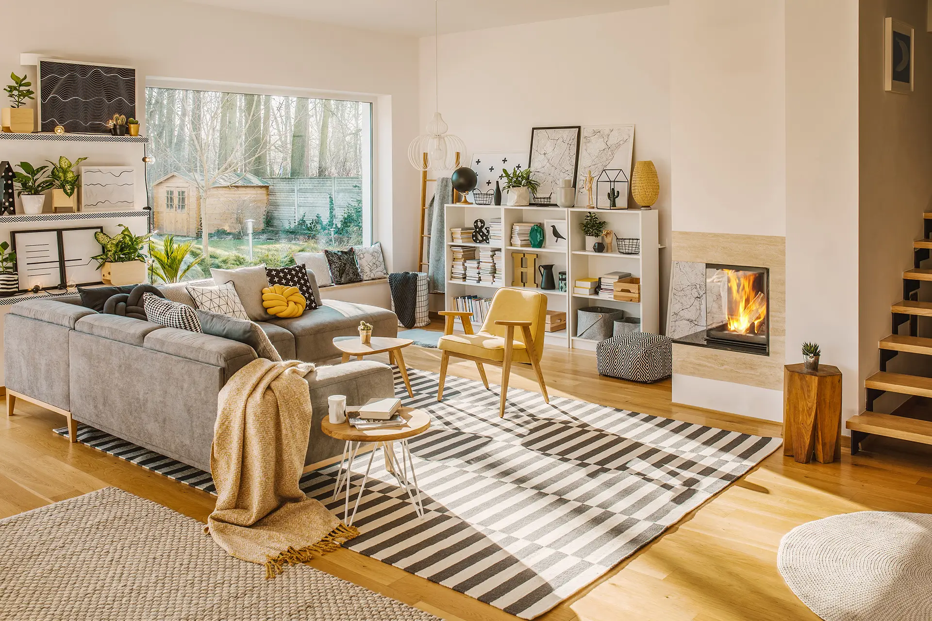 blanket-thrown-on-grey-corner-sofa-in-white-living-2024-10-18-09-53-34-utc